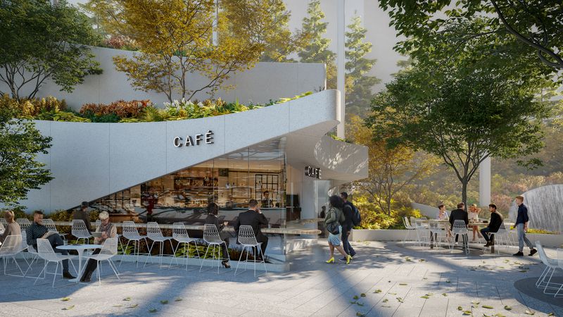 A cafe surrounded by trees and a seating area. 